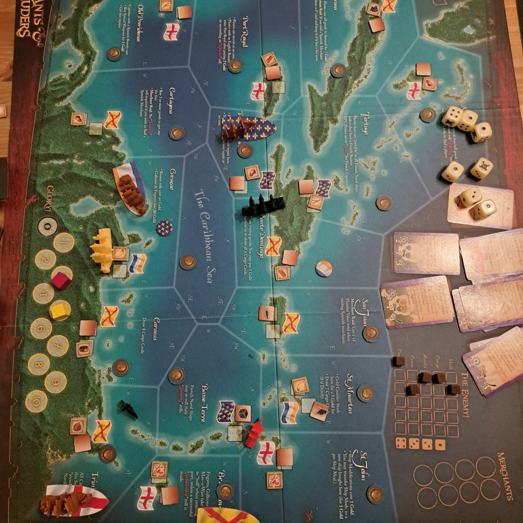 A top-down view of a board game set in the Caribbean, featuring various ships, islands, and tokens. The game board includes hexagonal tiles with illustrations of water and land, representing different locations and resources.